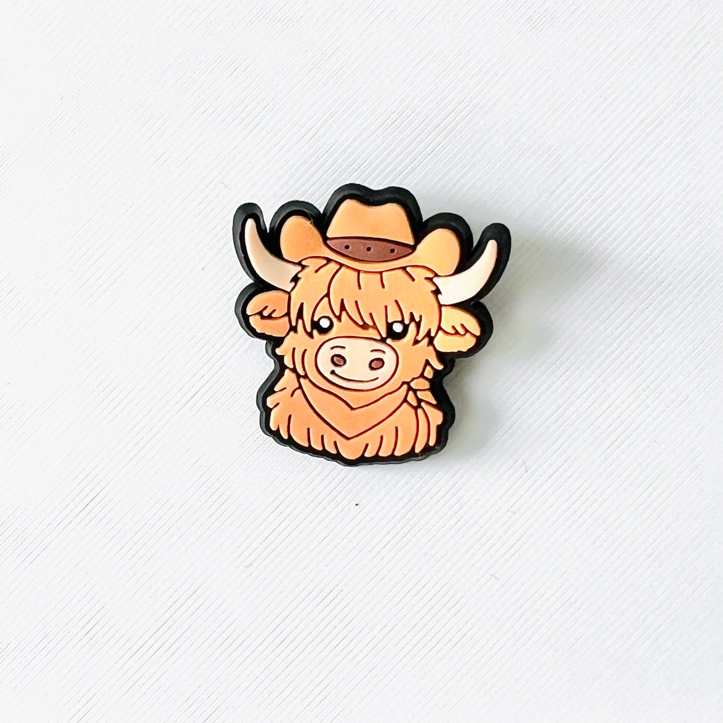 Charming brown Highland cow with a cowboy hat, perfect for adding western flair to your shoes. Fun and playful accessory!