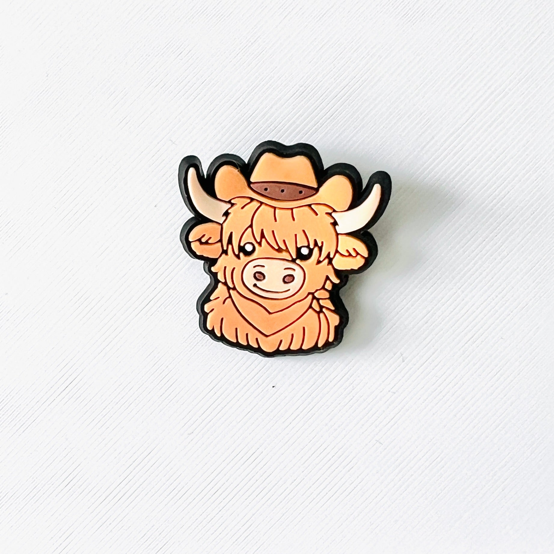 Charming brown Highland cow with a cowboy hat, perfect for adding western flair to your shoes. Fun and playful accessory!