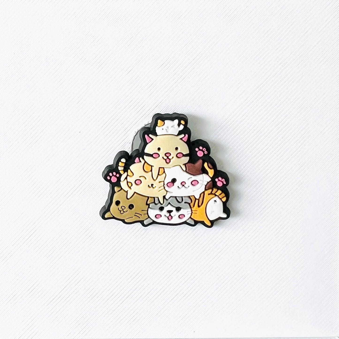 Cute stacked cats in playful colors, balancing on top of each other, perfect for adding charm to your shoes.