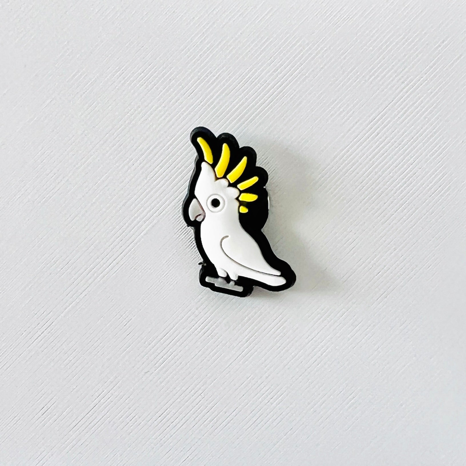 Bright sulphur-crested cockatoo charm with a playful expression and vibrant yellow crest, perfect for shoe decoration.