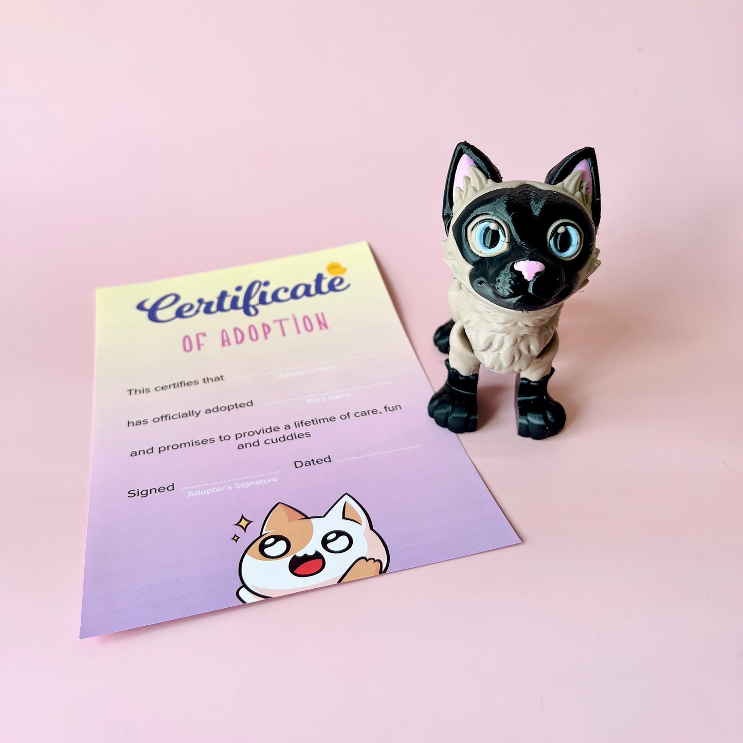 A playful cat figure stands beside a colorful adoption certificate on a soft pink background.