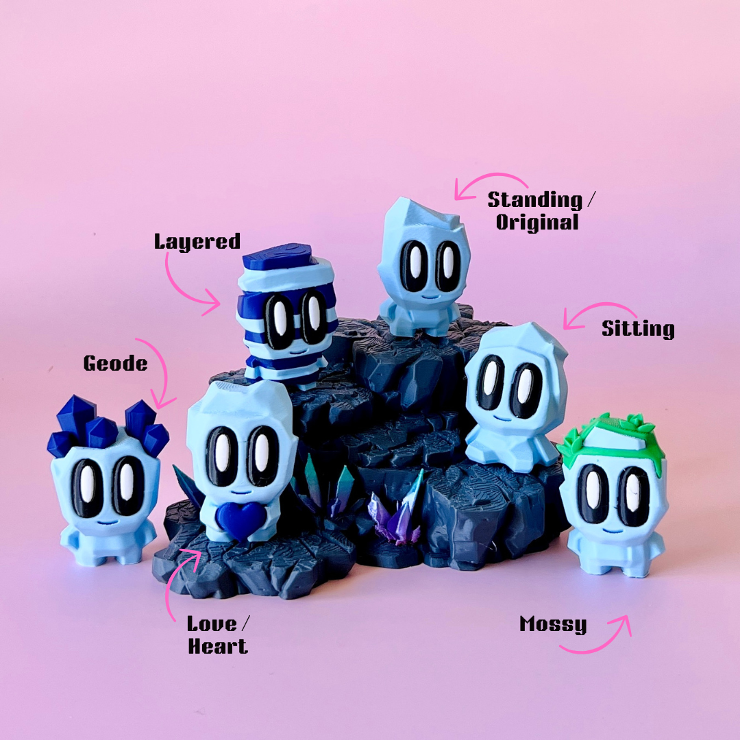 A group of pastel blue characters with large eyes, featuring varied designs and standing on a rocky base against a pink backd