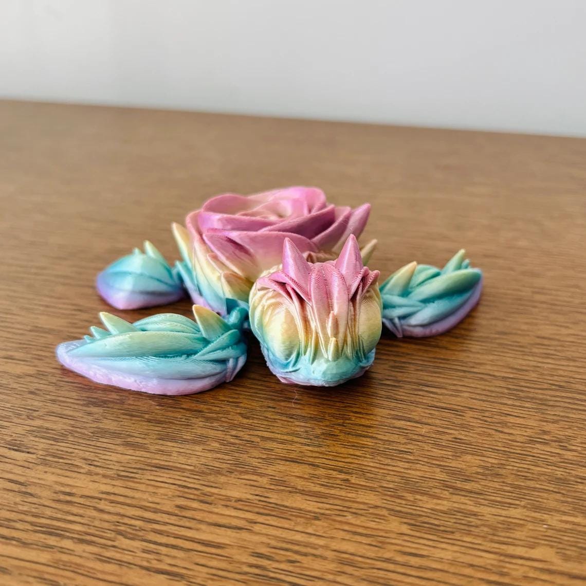 3D-printed turtle with a colorful rose-shaped shell, blending nature and artistry for eco-friendly decor.