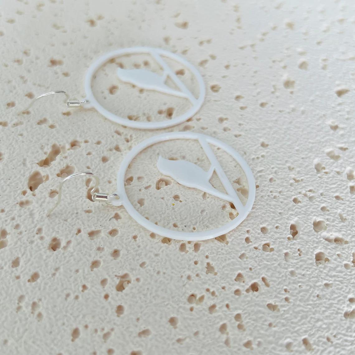 Elegant white bird dangle earrings with 925 sterling silver hooks, perfect for any occasion. Lightweight and stylish.