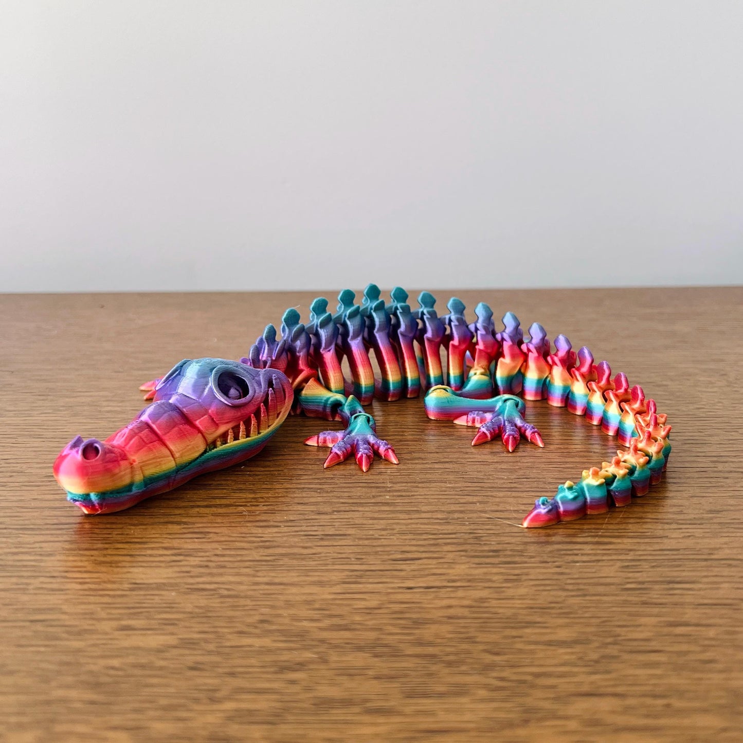Colorful articulated crocodile figurine showcasing intricate details and eco-friendly craftsmanship. Perfect for collectors.