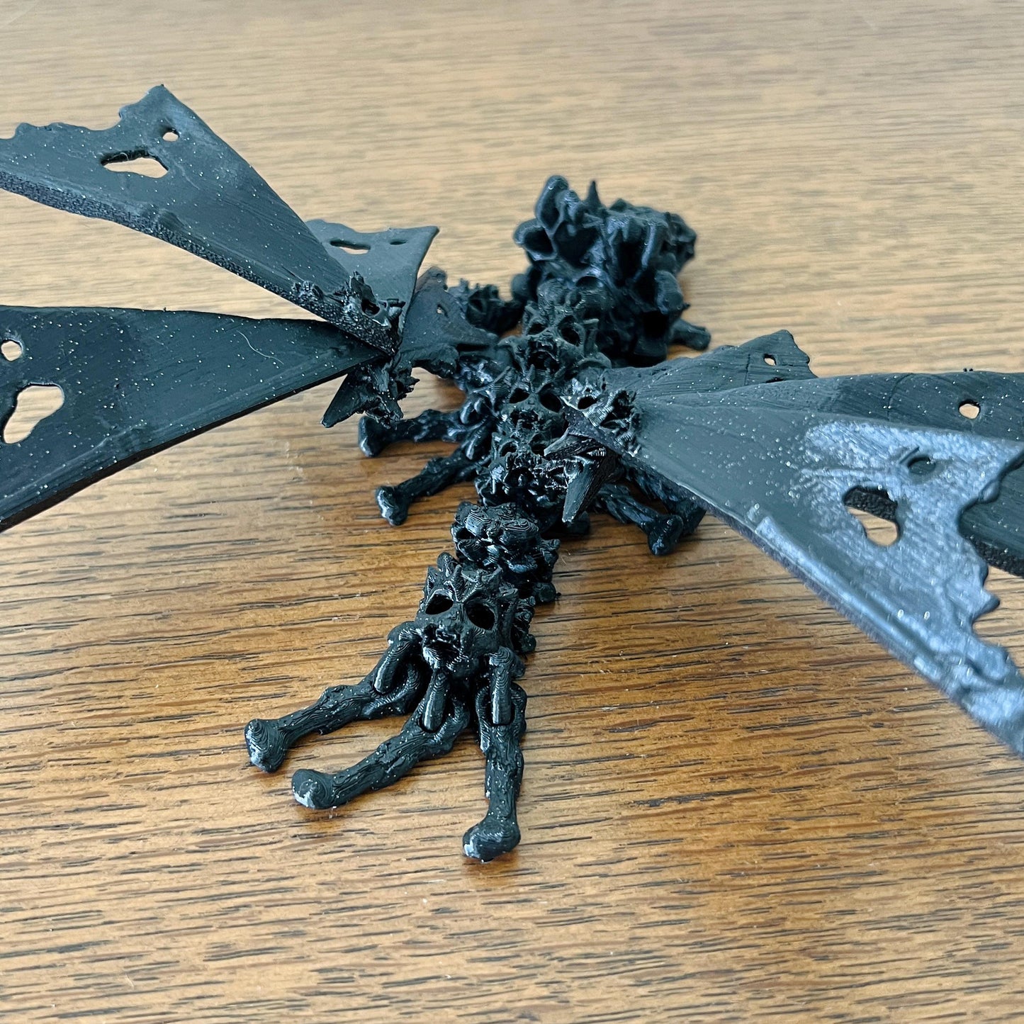A haunting dragon with skull-like features and hollow wings, exuding a mystical, edgy vibe.