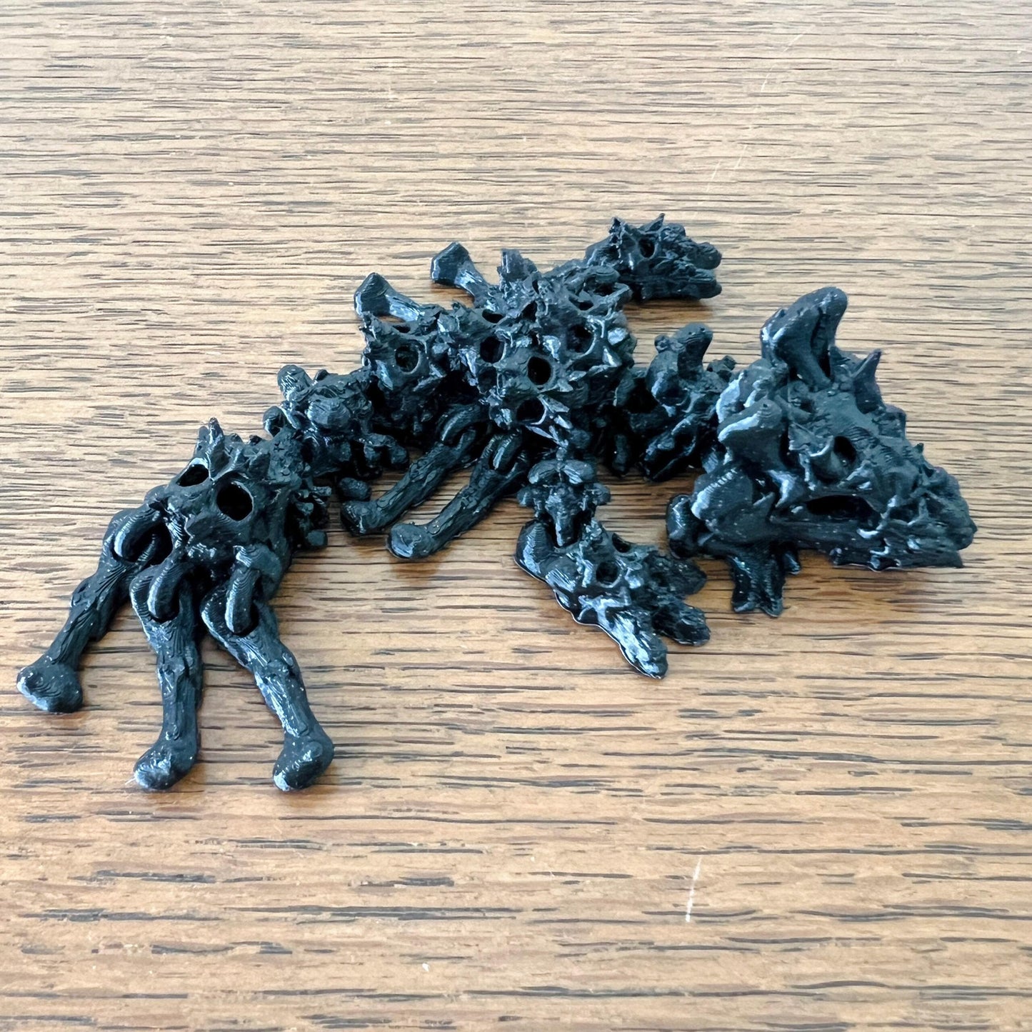 Hollow Skull Dragon Tadling with intricate, skull-like details and a dark, mystical aesthetic. Perfect for collections.
