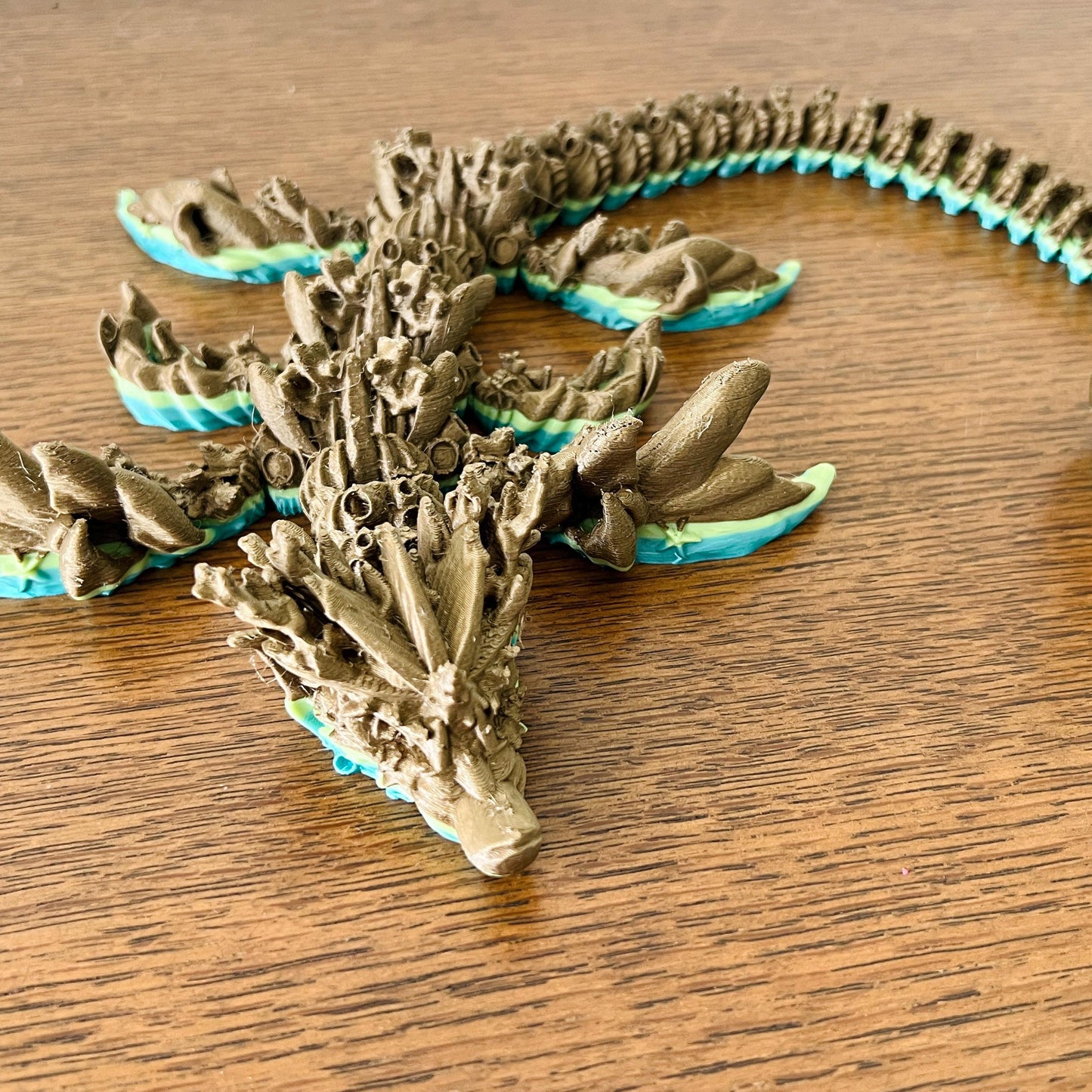Majestic coral dragon featuring intricate details and vibrant ocean hues, perfect for fantasy enthusiasts and collectors.