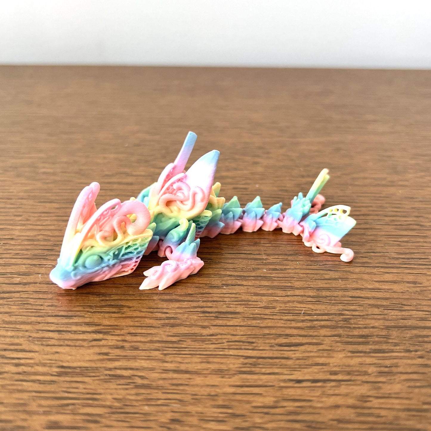 Colorful, articulated Mini Butterfly Dragon with intricate details and a whimsical design, perfect for fidgeting.