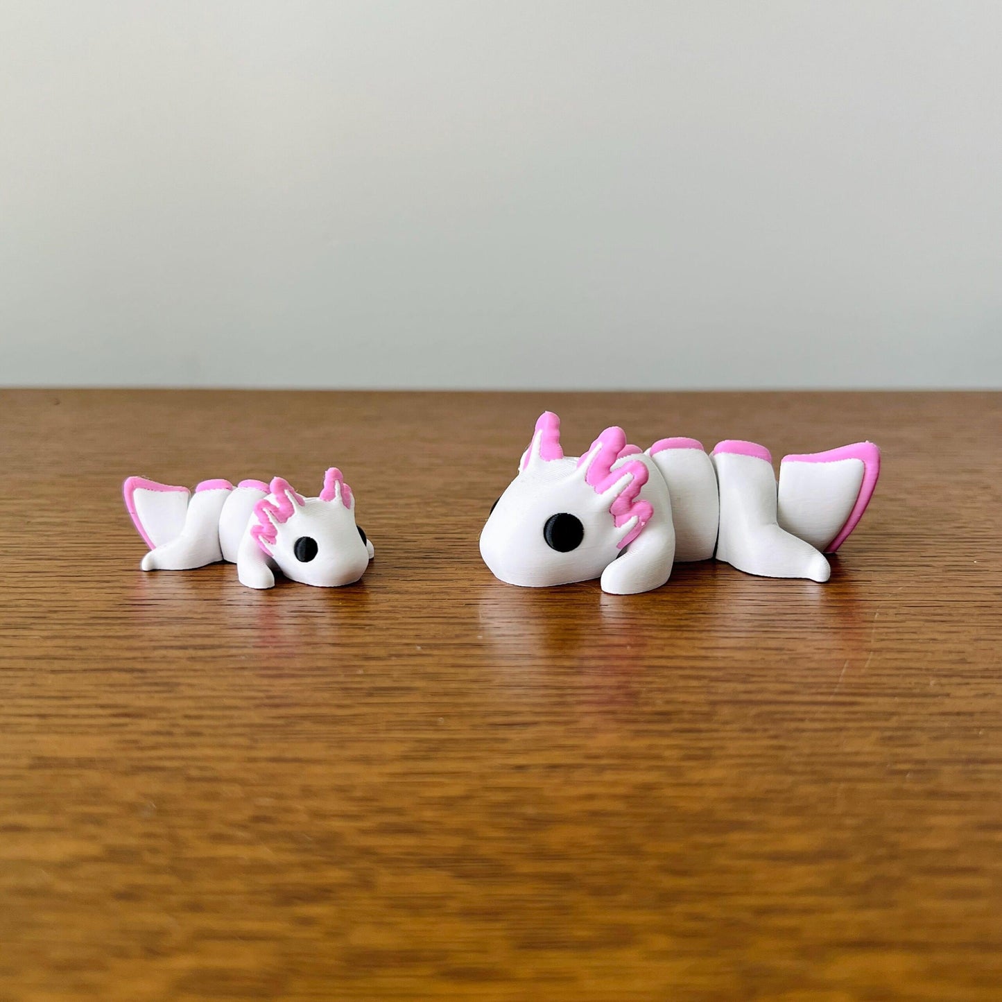 Charming white and pink Axolotls, perfect for sensory play, stress relief, or as delightful collectibles.