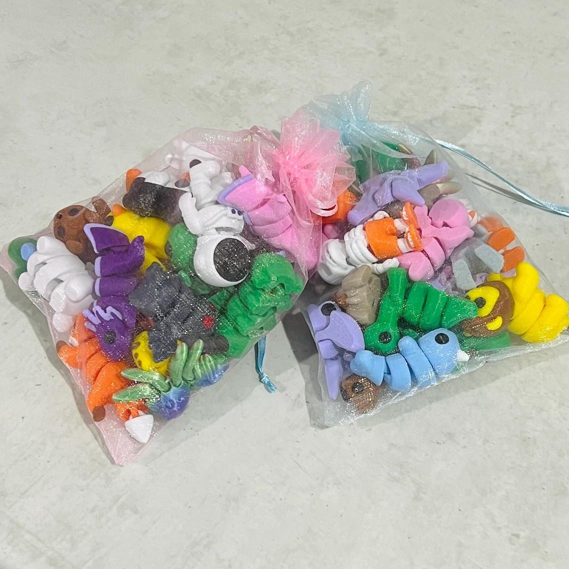 Colorful micro-sized fidget toys in two bags, showcasing various animals and food shapes, perfect for sensory play.