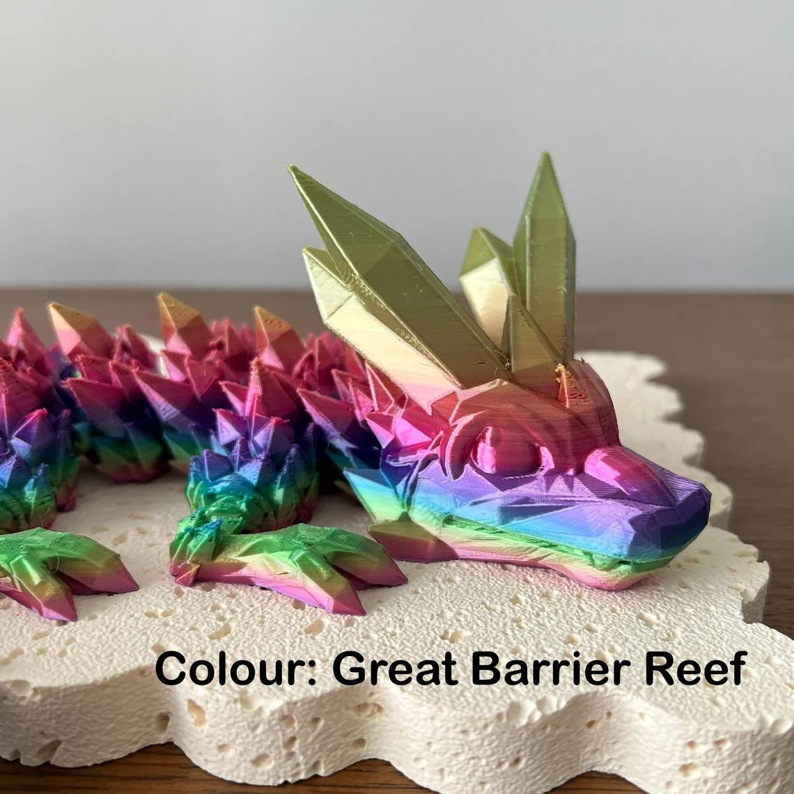 Vibrant 3D printed dragon in rainbow hues with crystal-like features, showcasing stunning detail and customization.