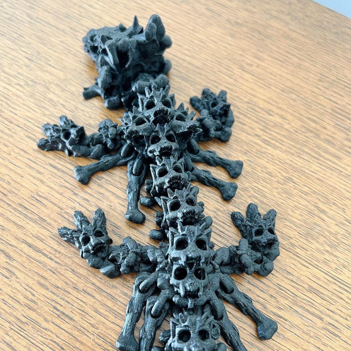 A charming, eerie hollow dragon with skull-like features and intricate details, perfect for dark fantasy enthusiasts.