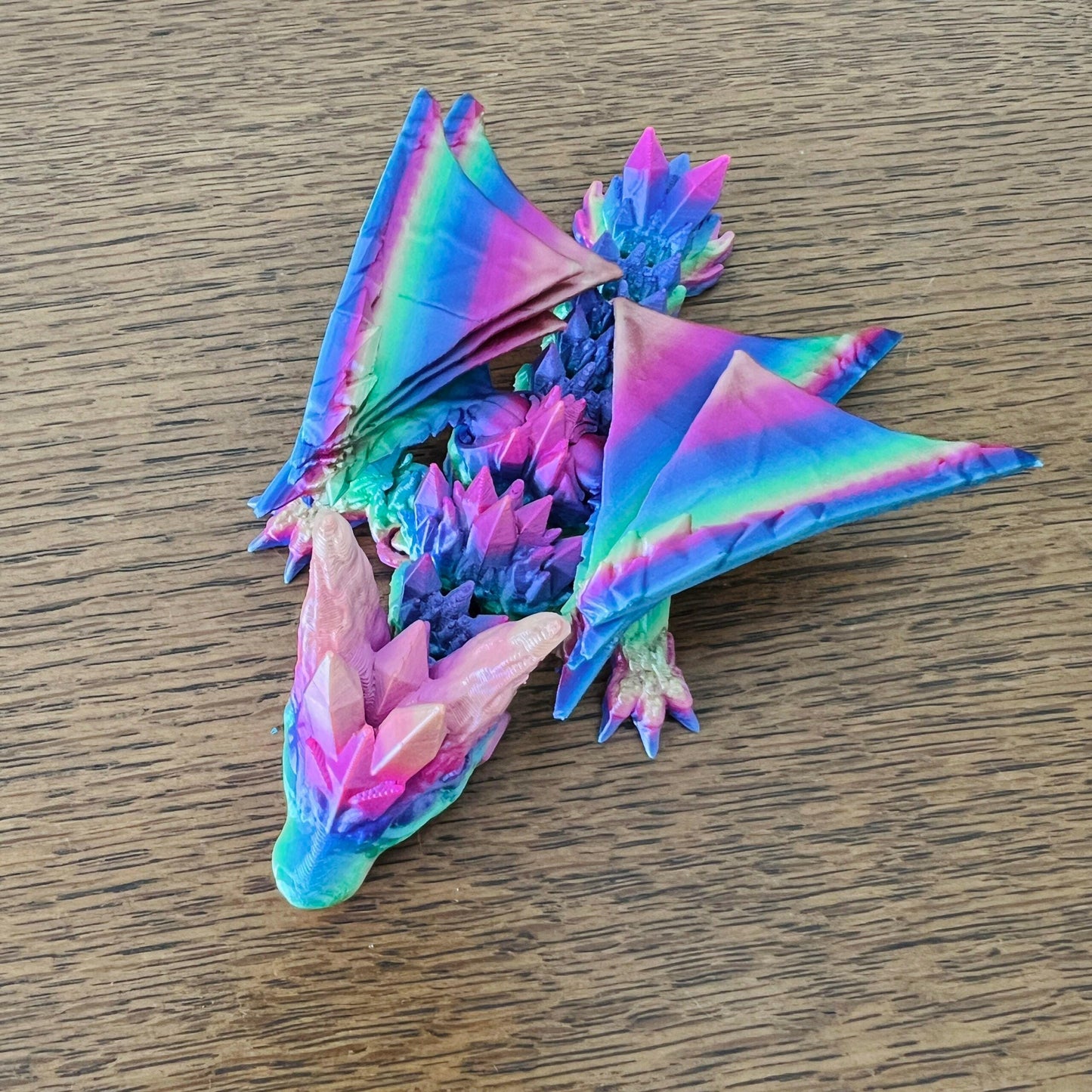 Colorful dragon with crystal-like details and elegant wings, showcasing a mystical beauty in vibrant hues.