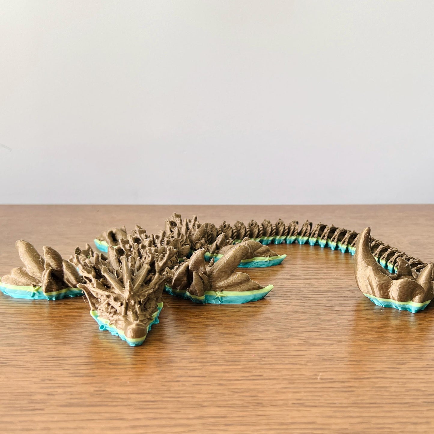 Majestic coral dragon featuring intricate details and vibrant ocean hues, perfect for collectors and fantasy enthusiasts.
