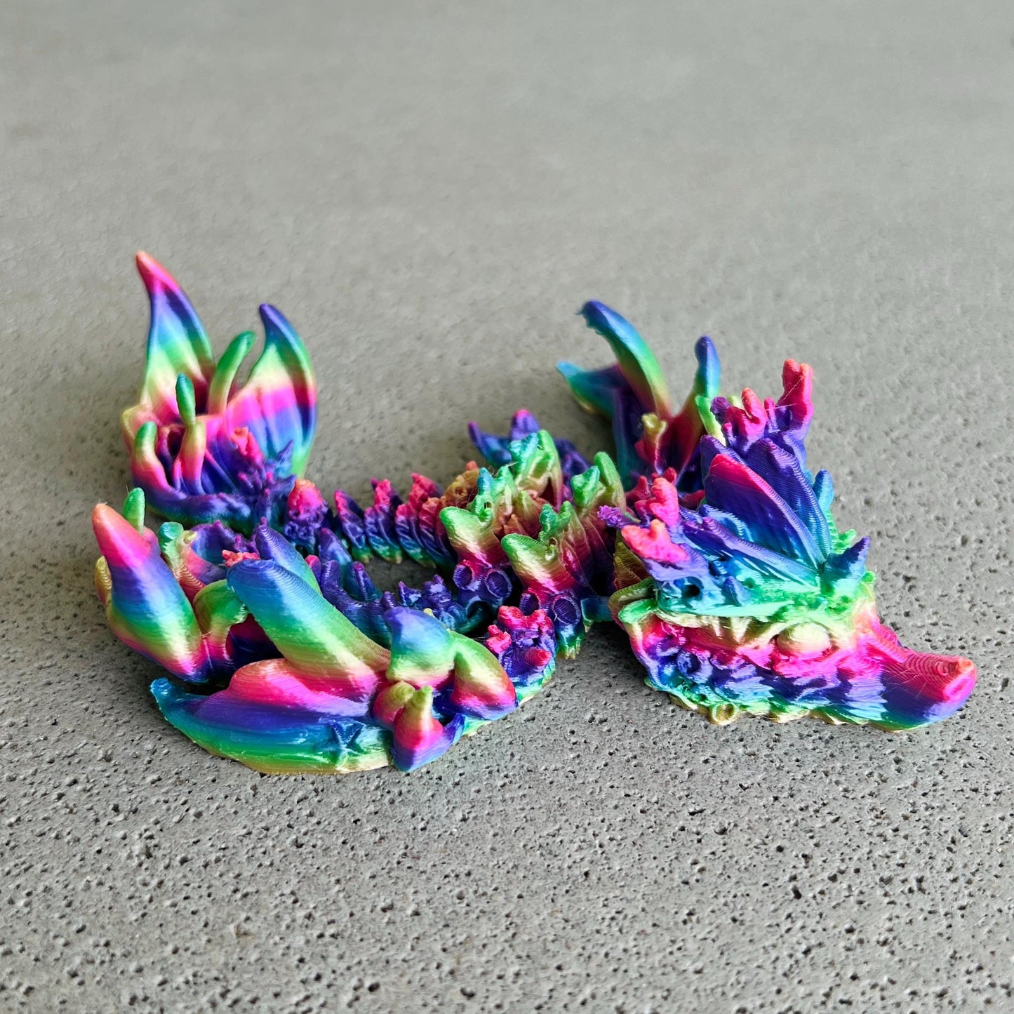 A vibrant, multi-colored dragon with intricate oceanic details, evoking a magical underwater realm.