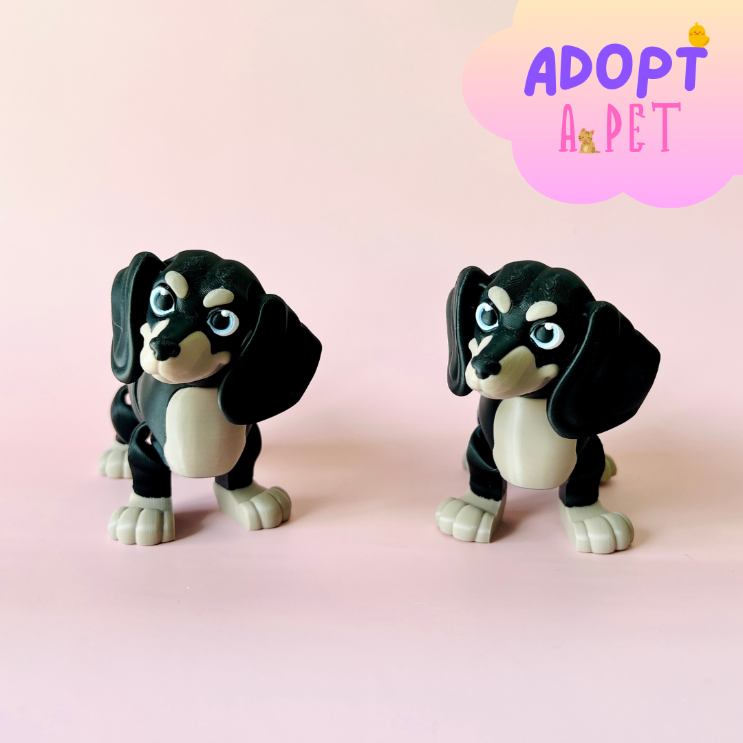 Two playful black and white cartoon dogs with expressive eyes, set against a soft pink background.