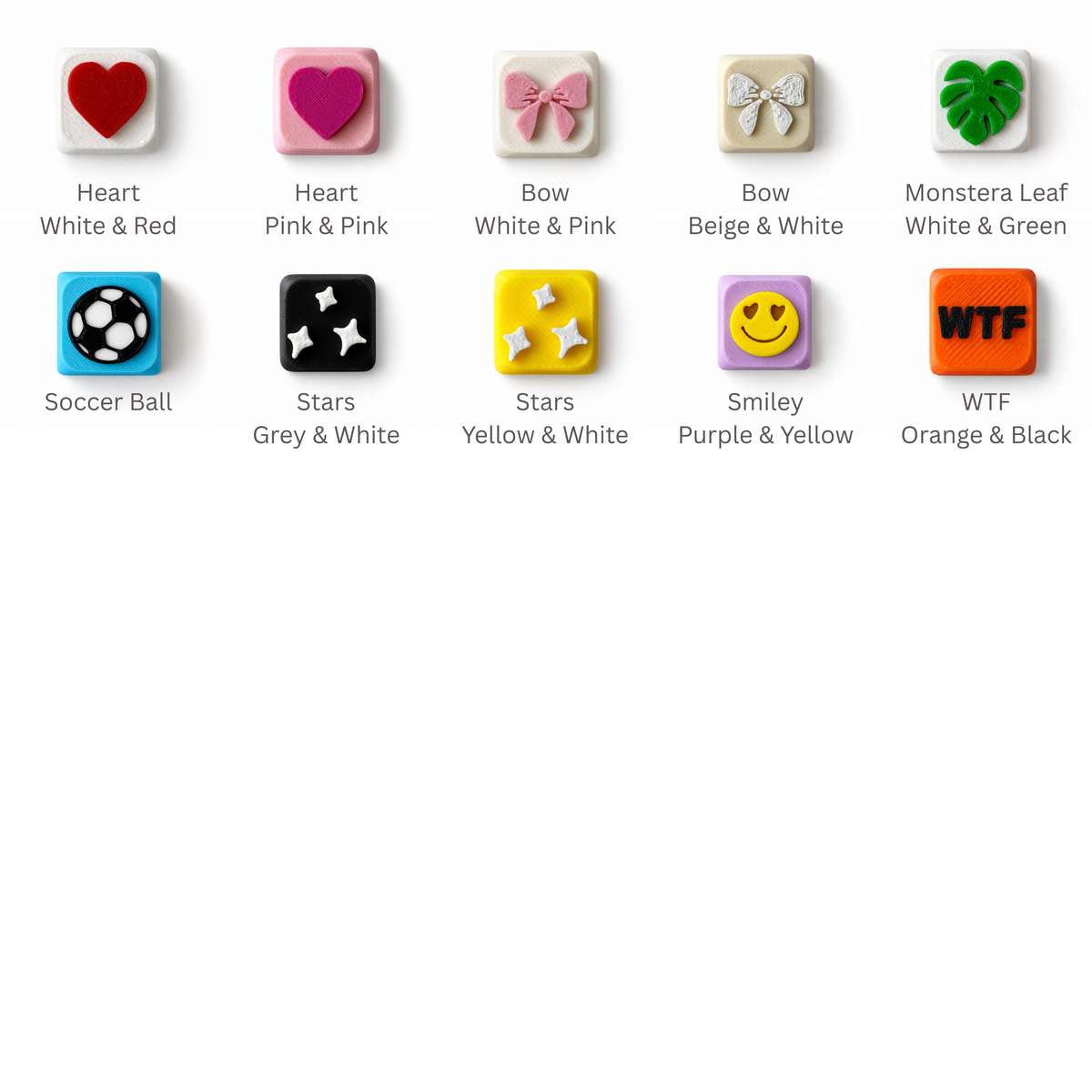 Fidget clicker keycap design options: heart, bow, monstera leaf, soccer ball, stars, smiley and WTF keycaps