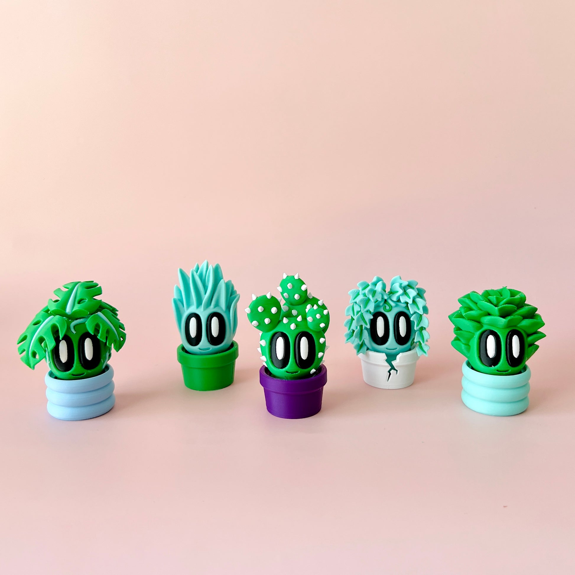 Colorful, whimsical plant figures with large eyes in various pots against a soft pink background.