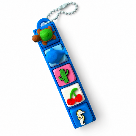 5 Key Fidget Clicker, 3D printed fidget clicker in blue with turtle, whale, cactus, cherry and seahorse keycaps