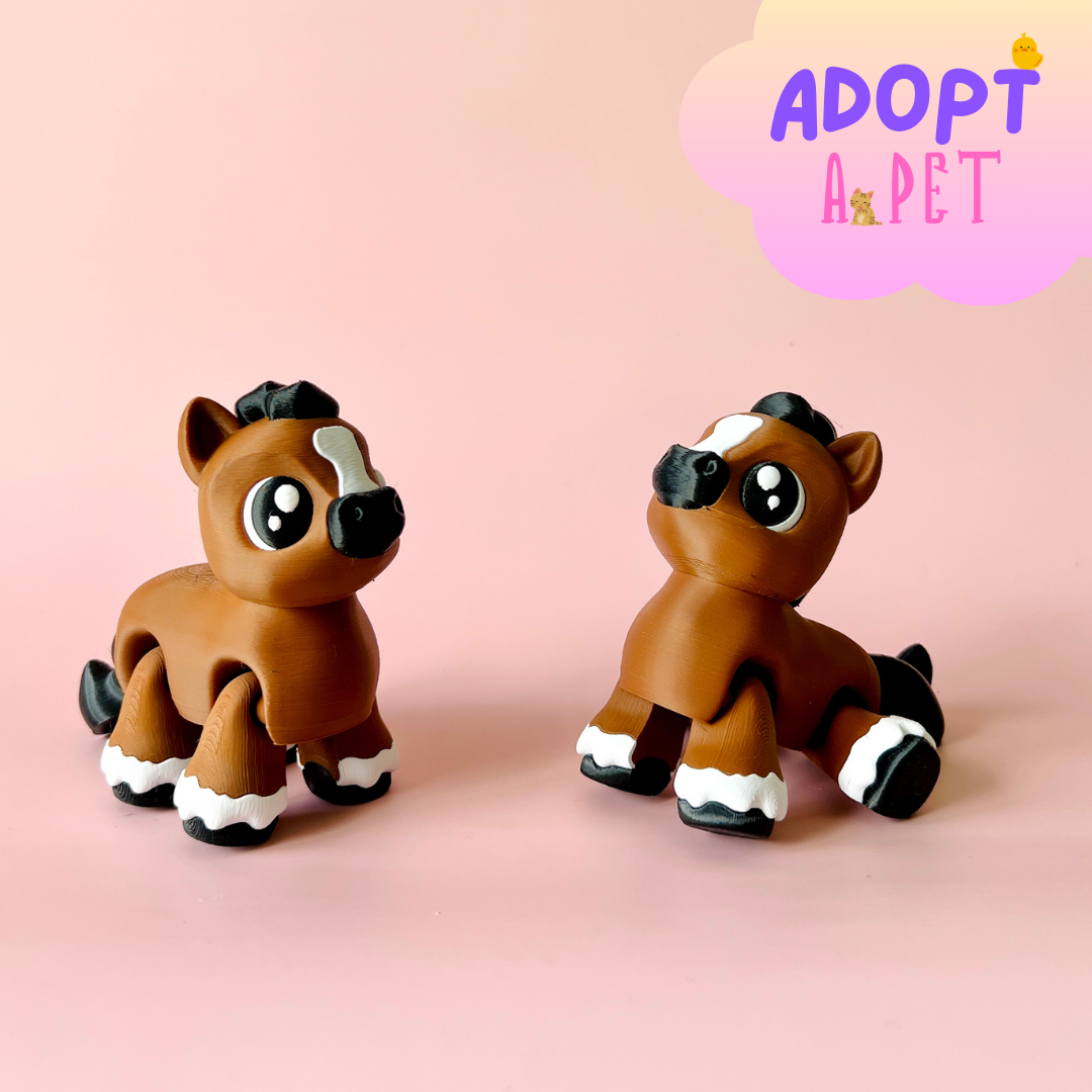 Two cute, brown horses with large eyes and distinctive markings, set against a soft pink background.