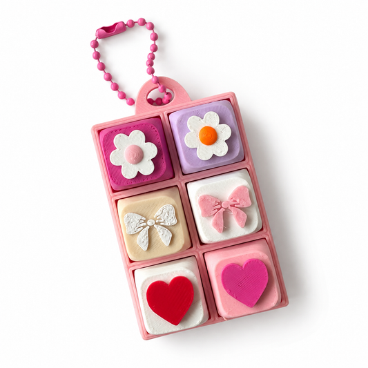 6 Key Fidget Clicker Rectangle, 3D printed fidget clicker in pink with flower, bow and heart keycaps