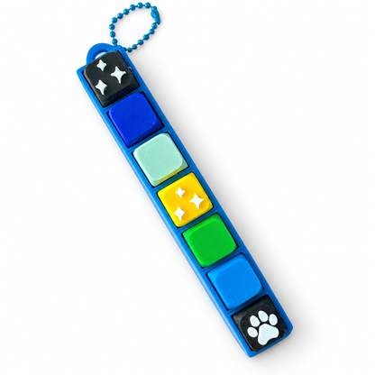 7 Key Fidget Clicker, 3D printed fidget clicker in blue with blue, yellow, green and paw keycaps