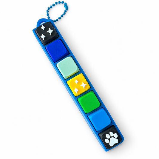 7 Key Fidget Clicker, 3D printed fidget clicker in blue with blue, yellow, green and paw keycaps