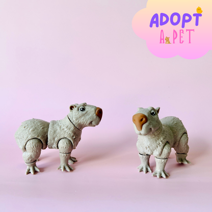 Two whimsical creatures with furry bodies and playful expressions against a soft pink backdrop.