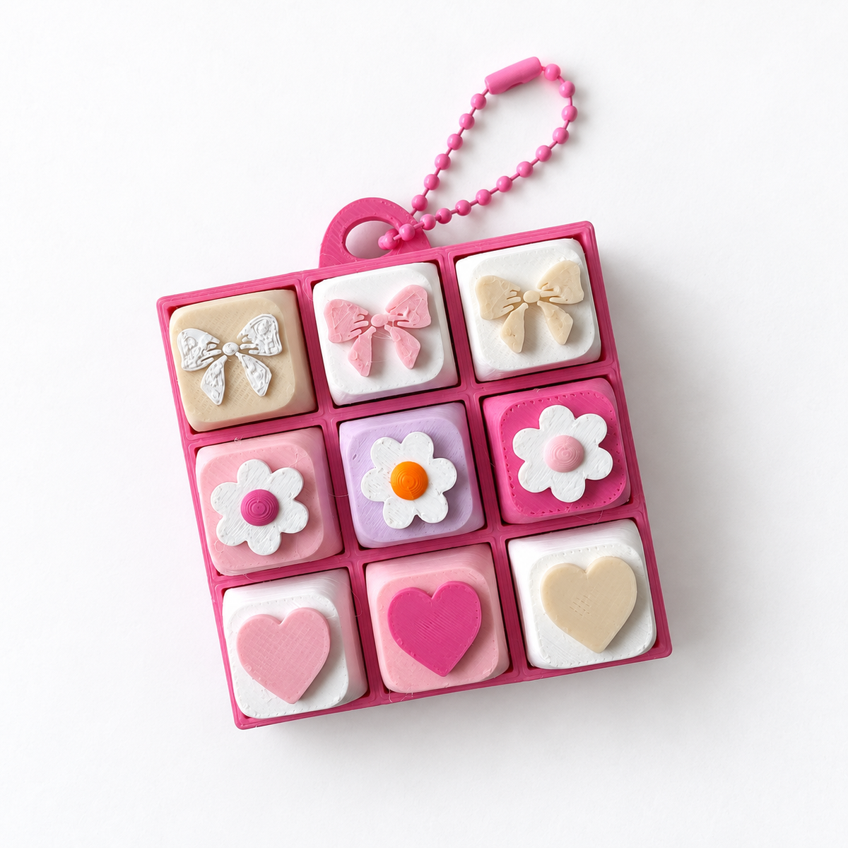 9 Key Fidget Clicker Square, 3D printed fidget clicker in pink with bow, daisy and heart keycaps