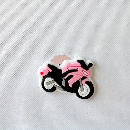 A black and pink motorcycle illustration on a textured white background.
