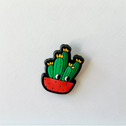 Colorful cactus illustration in a red pot with yellow flowers, set against a textured white background.