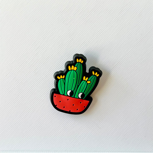 Colorful cactus illustration in a red pot with yellow flowers, set against a textured white background.
