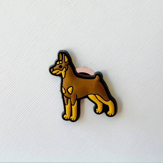 A playful, stylized depiction of a brown dog with a pink accent, set against a textured white background.
