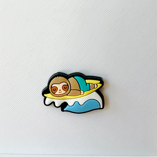 A cheerful sloth lounging on a surfboard, surrounded by waves, set against a textured white background.