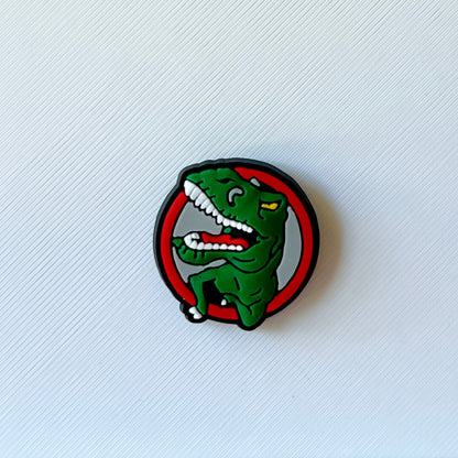 A vibrant green dinosaur illustration with a playful expression inside a bold circular border.