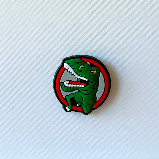 A vibrant green dinosaur illustration with a playful expression inside a bold circular border.