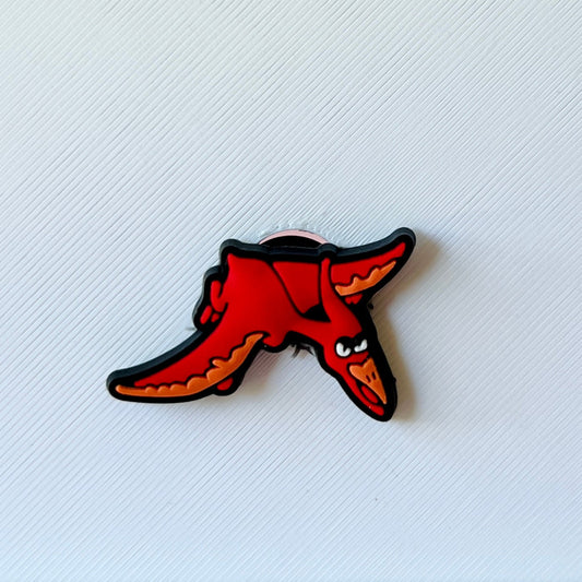 A cartoonish red pterosaur with an expressive face, set against a textured white background.
