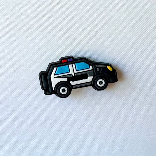 Colorful police vehicle with a light on top, set against a textured white background.