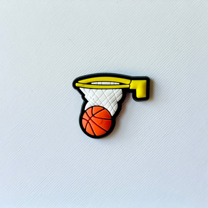 Colorful basketball hoop with a ball, set against a textured white background, showcasing vibrant details and playful design.