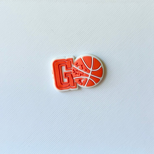 Orange "GO" text alongside a basketball graphic on a textured white background.