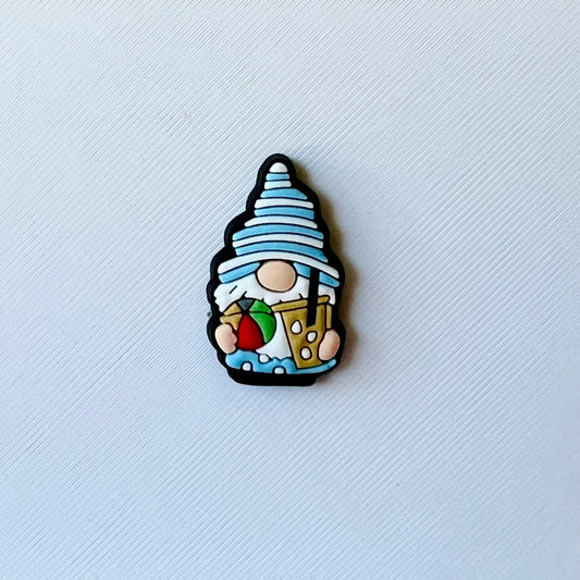 A whimsical figure with a blue striped hat, holding a drink and a strawberry against a textured white background.