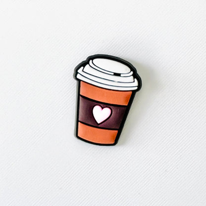 Charming coffee cup with a heart, featuring a stylish design, perfect for attaching to your favorite footwear.