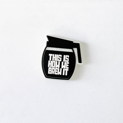 Black coffee brew pot charm with bold "This Is How We Brew It" text, perfect for coffee lovers and baristas.