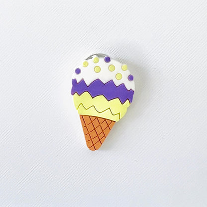 Colorful ice cream cone charm featuring three scoops: white, purple, and yellow, atop a textured cone. Perfect for shoe decor