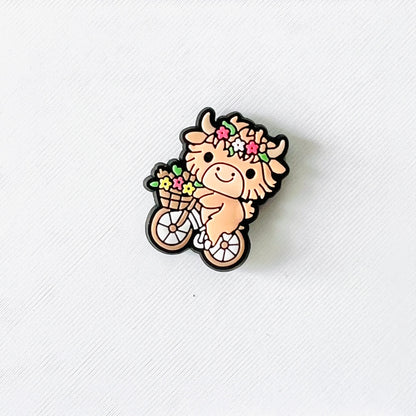 Adorable cow with a flower crown riding a bicycle, holding a basket of colorful flowers. Perfect for cheerful shoe accents!