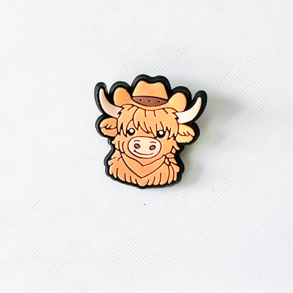Charming brown Highland cow with a cowboy hat, perfect for adding western flair to your shoes. Fun and playful accessory!