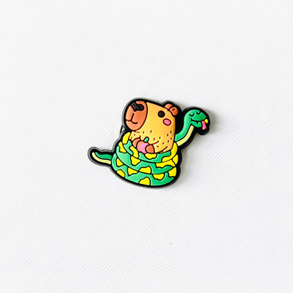A cheerful capybara wrapped in a green snake, both with playful details, perfect for animal lovers.