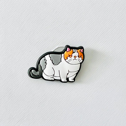Adorable tabby cat charm featuring gray and white fur with orange accents, perfect for adding cuteness to your shoes.