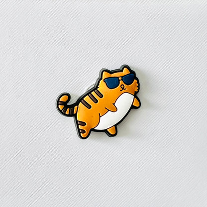 Orange cat wearing sunglasses, with a playful expression, perfect for adding fun vibes to shoes.